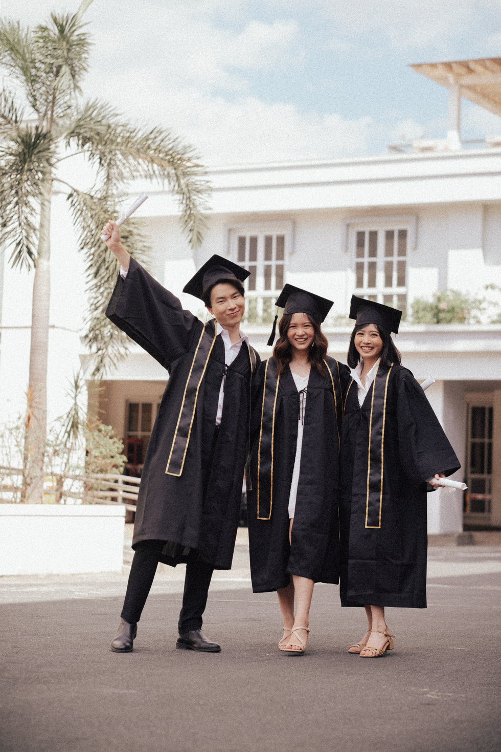 Three Male and Female Friends on Their Graduation Day
